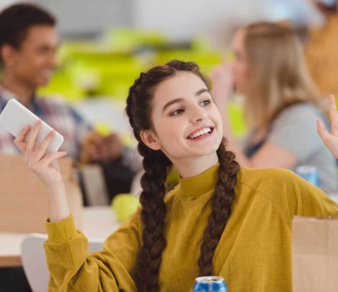 happy-teen-schoolgirl-sitting-at-school-cafeteria-2022-12-16-18-12-22-utc.jpg